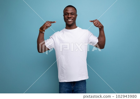 30 year old American male adult in a white t-shirt shows his smile with his hands 102943980