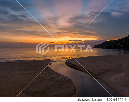 .aerial view stunning reflection of bright golden sky in a canal at Karon beach Phuket. 102944614