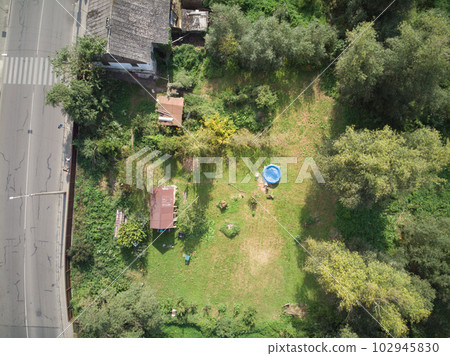 The top view of Jatujak park in Bangkok city. In the morning people are love coming to exercise here. The garden is designed in to the geometry of circular and triangle look like peaceful sign. 102945830