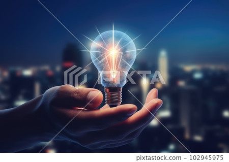 a hand holding light bulb, futuristic and brain stroming 102945975