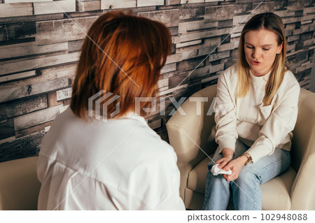Woman psychologist talking to patient girl. Consultation with counsellor Woman psychologist talking to patient girl. Consultation with counsellor 102948088