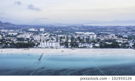 Mallorca sandy beach in Alcudia aerial view. 102950126