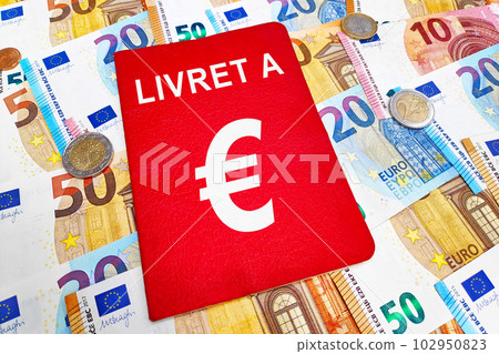Livret A passbook atop of a stack of Euros Livret A passbook atop of a stack of Euros 102950823
