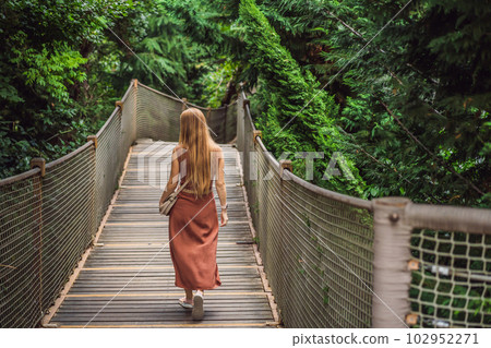 Woman tourist in Rope bridge in Yildiz Park. Besiktas, Istanbul, Turkey. Turkiye Woman tourist in Rope bridge in Yildiz Park. Besiktas, Istanbul, Turkey. Turkiye 102952271