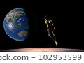 Astronaut jumping on the moon with the earth in the background 102953599