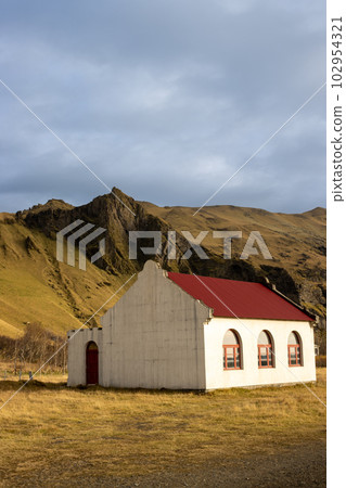House and mountains, south Iceland 102954321