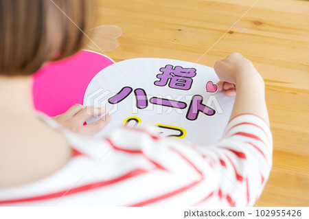 Hand photo of a woman making concert goods 102955426