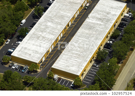 Aerial view of industrial park with goods warehouses and logistics centers in city zone from above 102957524