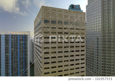 Aerial view of downtown office district of of Miami Brickell in Florida, USA at sunset. High commercial and residential skyscraper buildings in modern american megapolis Aerial view of downtown office district of of Miami Brickell in Florida, USA at sunset. High commercial and residential skyscraper buildings in modern american megapolis 102957553