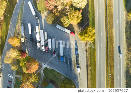 Aerial view of big rest area near busy american freeway with fast moving cars and trucks. Recreational place during interstate travel concept 102957627