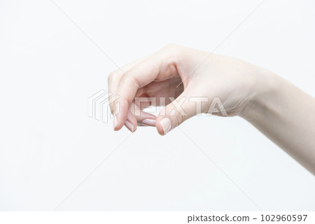 Woman's hand grabbing something 1 Woman's hand grabbing something 1 102960597