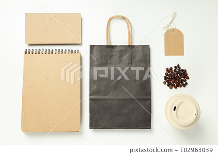 Mockup flat lay with craft accessories and coffee beans on white background Mockup flat lay with craft accessories and coffee beans on white background 102963039