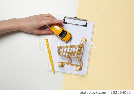 Concept of buying a car with toy car 102964092