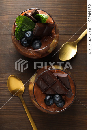 Concept of delicious and sweet food - chocolate mousse Concept of delicious and sweet food - chocolate mousse 102964120