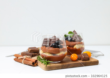 Concept of delicious and sweet food - chocolate mousse Concept of delicious and sweet food - chocolate mousse 102964125