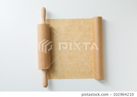 Concept of accessories for cooking and baking - baking paper 102964210