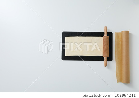 Concept of accessories for cooking and baking - baking paper 102964211