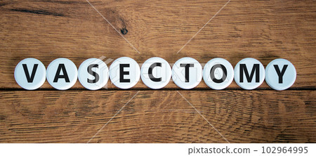 Vasectomy symbol. Concept words Vasectomy on white circles. Beautiful wooden table wooden background. Medical and vasectomy problem concept. Conceptual image. Copy space. Vasectomy symbol. Concept words Vasectomy on white circles. Beautiful wooden table wooden background. Medical and vasectomy problem concept. Conceptual image. Copy space. 102964995
