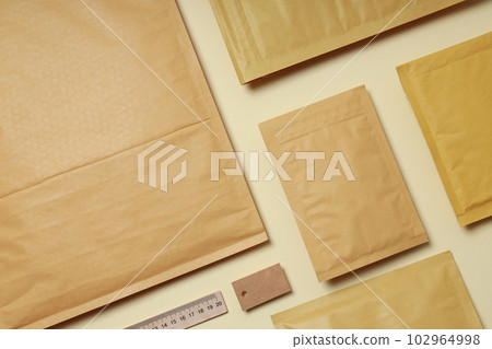 Flat lay with blank packages on beige background 102964998