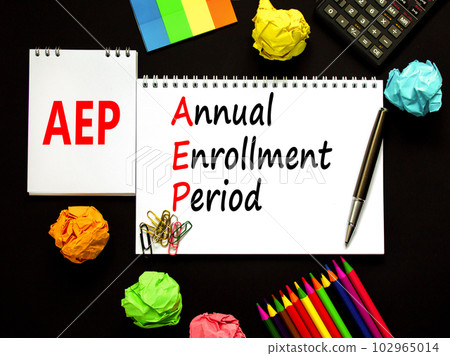 AEP symbol. Concept words AEP Annual enrollment period on beautiful white note. Beautiful black table black background. Calculator. Medical and AEP Annual enrollment period concept. Copy space. 102965014
