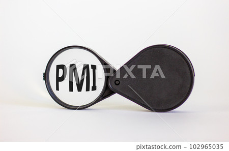 Magnifying glass with text 'PMI' - 'Purchasing Managers Index' on beautiful white background. Business concept, copy space. Magnifying glass with text 'PMI' - 'Purchasing Managers Index' on beautiful white background. Business concept, copy space. 102965035