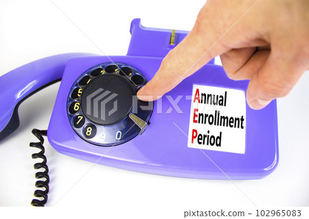 AEP symbol. Concept words AEP Annual enrollment period on beautiful old disk phone. Doctor hand. Beautiful white table white background. Medical and AEP Annual enrollment period concept. Copy space. AEP symbol. Concept words AEP Annual enrollment period on beautiful old disk phone. Doctor hand. Beautiful white table white background. Medical and AEP Annual enrollment period concept. Copy space. 102965083