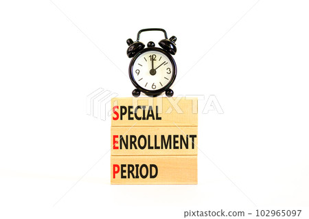 SEP symbol. Concept words SEP Special enrollment period on beautiful wooden block. Black alarm clock. Beautiful white table white background. Medical SEP Special enrollment period concept. Copy space. 102965097