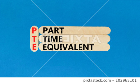 PTE Part time equivalent symbol. Concept words PTE Part time equivalent on wooden sticks. Beautiful blue table blue background. Business and PTE Part time equivalent concept. Copy space. 102965101