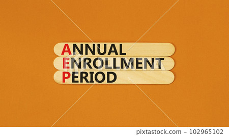 AEP symbol. Concept words AEP Annual enrollment period on beautiful wooden sticks. Beautiful orange table orange background. Medical and AEP Annual enrollment period concept. Copy space. 102965102