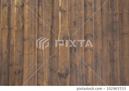 Brown vertical wood texture background coming from natural tree. Brown vertical wood texture background coming from natural tree. 102965533