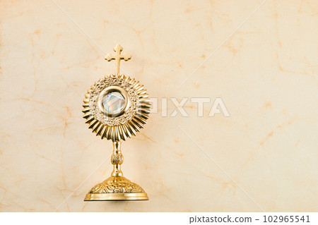 Ostensory for worship for Catholic church ceremony. Corpus christi. 102965541