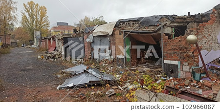 Burnt cars in destroyed garages during war in Ukraine. Russian-Ukrainian War. Burnt cars in destroyed garages during war in Ukraine. Russian-Ukrainian War. 102966087