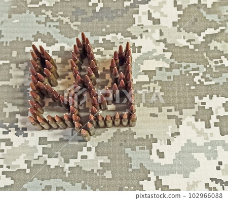 coat of arms of Ukraine laid out from cartridges. War Concept. Heap of billets coat of arms of Ukraine laid out from cartridges. War Concept. Heap of billets 102966088