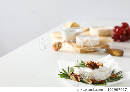 Concept of delicious French food - Camembert cheese Concept of delicious French food - Camembert cheese 102967017
