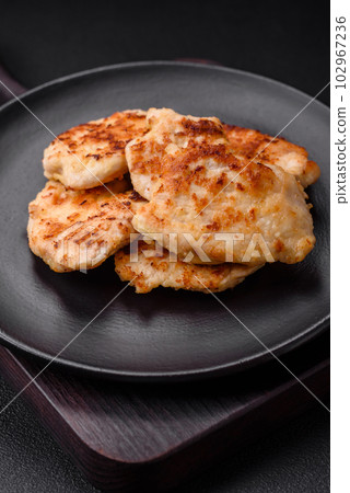 Delicious fried chicken meat chops with spices, salt and herbs 102967236