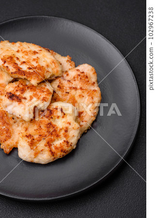 Delicious fried chicken meat chops with spices, salt and herbs 102967238