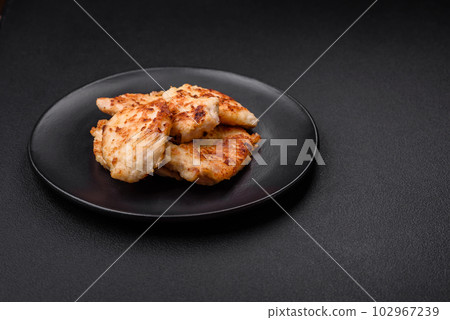 Delicious fried chicken meat chops with spices, salt and herbs 102967239