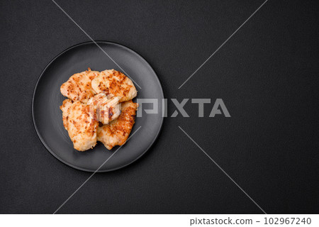 Delicious fried chicken meat chops with spices, salt and herbs Delicious fried chicken meat chops with spices, salt and herbs 102967240