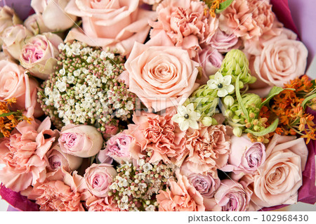 close up Beautiful bouquet of flowers on table. Floral shop concept . Beautiful fresh cut bouquet. Flowers delivery 102968430