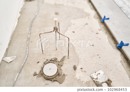 Large Ceramic tiles in the loft style, concrete. Repair of the dining room in the house, place for kitchen, floor covering change. Empty interior for design, gray concrete wall. Large Ceramic tiles in the loft style, concrete. Repair of the dining room in the house, place for kitchen, floor covering change. Empty interior for design, gray concrete wall. 102968453