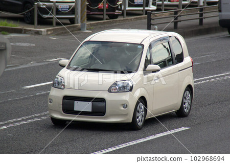 Compact car road driving 102968694