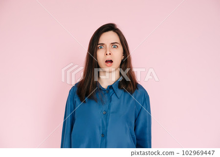 Stunning Portrait of a Speechless Woman in Utter Shock, Wide Open Mouth, Expressing Unbelievable Stunning Portrait of a Speechless Woman in Utter Shock, Wide Open Mouth, Expressing Unbelievable 102969447