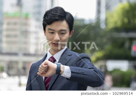 A young businessman looking at a Smart Watch 102969514