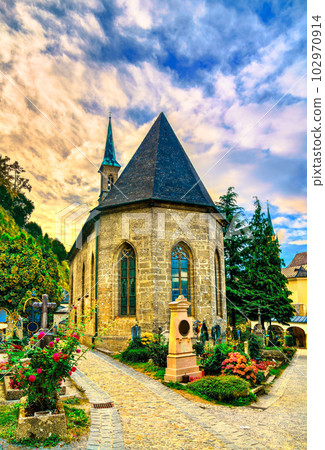 St. Mary Chapel with gravestones in Salzburg, Austria at sunset 102970914