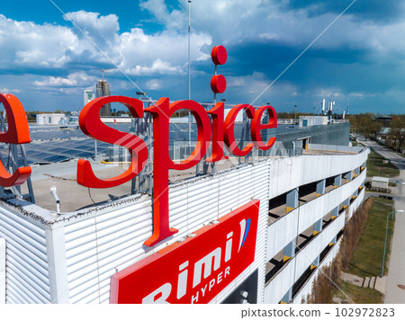 Aerial view of the Spice shopping mall in Riga, Latvia. Roof is covered with solar panels. Aerial view of the Spice shopping mall in Riga, Latvia. Roof is covered with solar panels. 102972823