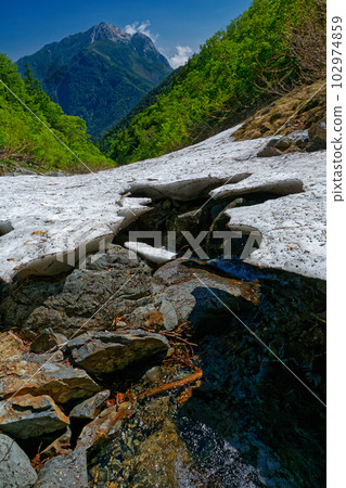 Mt. Kaikomagatake and remaining snow in Yabusawa of Mt. Senjogatake in the Southern Alps Mt. Kaikomagatake and remaining snow in Yabusawa of Mt. Senjogatake in the Southern Alps 102974859
