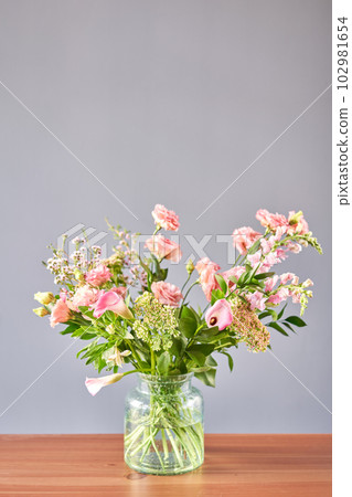 Bouquet 001. Finished flower arrangement in a vase for home. Flowers bunch, set for interior. Fresh cut flowers for decoration home. European floral shop. Delivery fresh cut flower. Bouquet 001. Finished flower arrangement in a vase for home. Flowers bunch, set for interior. Fresh cut flowers for decoration home. European floral shop. Delivery fresh cut flower. 102981654