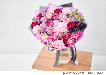 Beautiful bouquet of flowers on table. Floral shop concept . Beautiful fresh cut bouquet. Flowers delivery 102981664