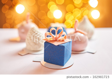 Merry Christmas card. Variety of sweet delicious cakes. Fir branches on a gray background. Merry Christmas card. New year mood 102981723