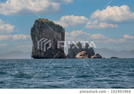 Phi Phi Le Islands, Krabi Province. Amazing nature scenic landscape with boat for traveler. Beautiful seascape. Tourist on Long tail boat trip. Tourism destination place Asia Phi Phi Le Islands, Krabi Province. Amazing nature scenic landscape with boat for traveler. Beautiful seascape. Tourist on Long tail boat trip. Tourism destination place Asia 102983968